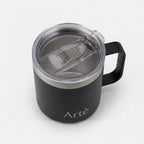 ArtèCup matte black insulated stainless steel mug with a clear leak-proof lid and ergonomic handle, top view.