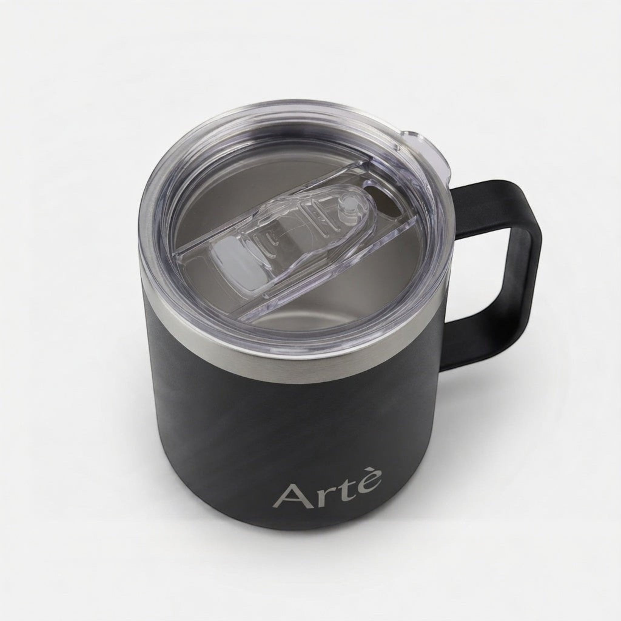 ArtèCup matte black insulated stainless steel mug with a clear leak-proof lid and ergonomic handle, top view.