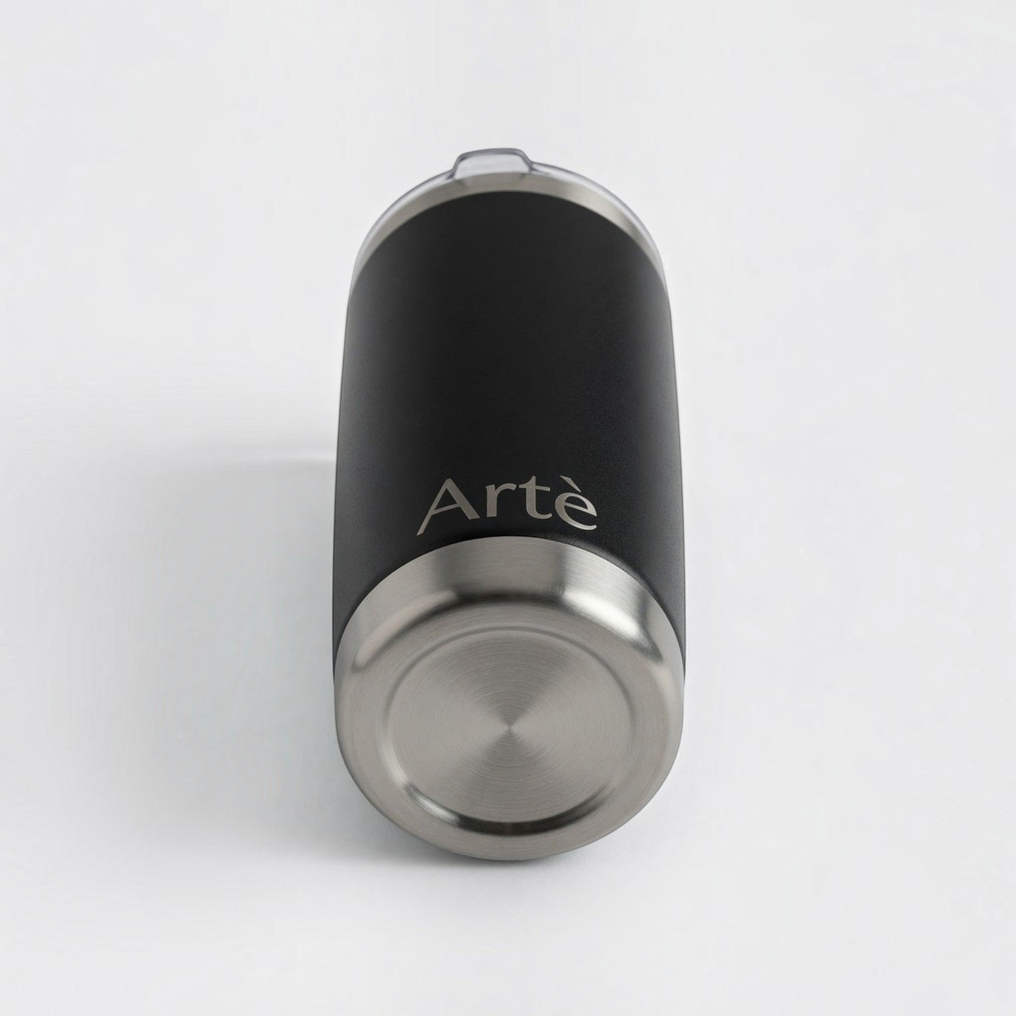 ArtèCup 20oz matte black stainless steel vacuum insulated tumbler with a clear lid, viewed from the bottom angle.