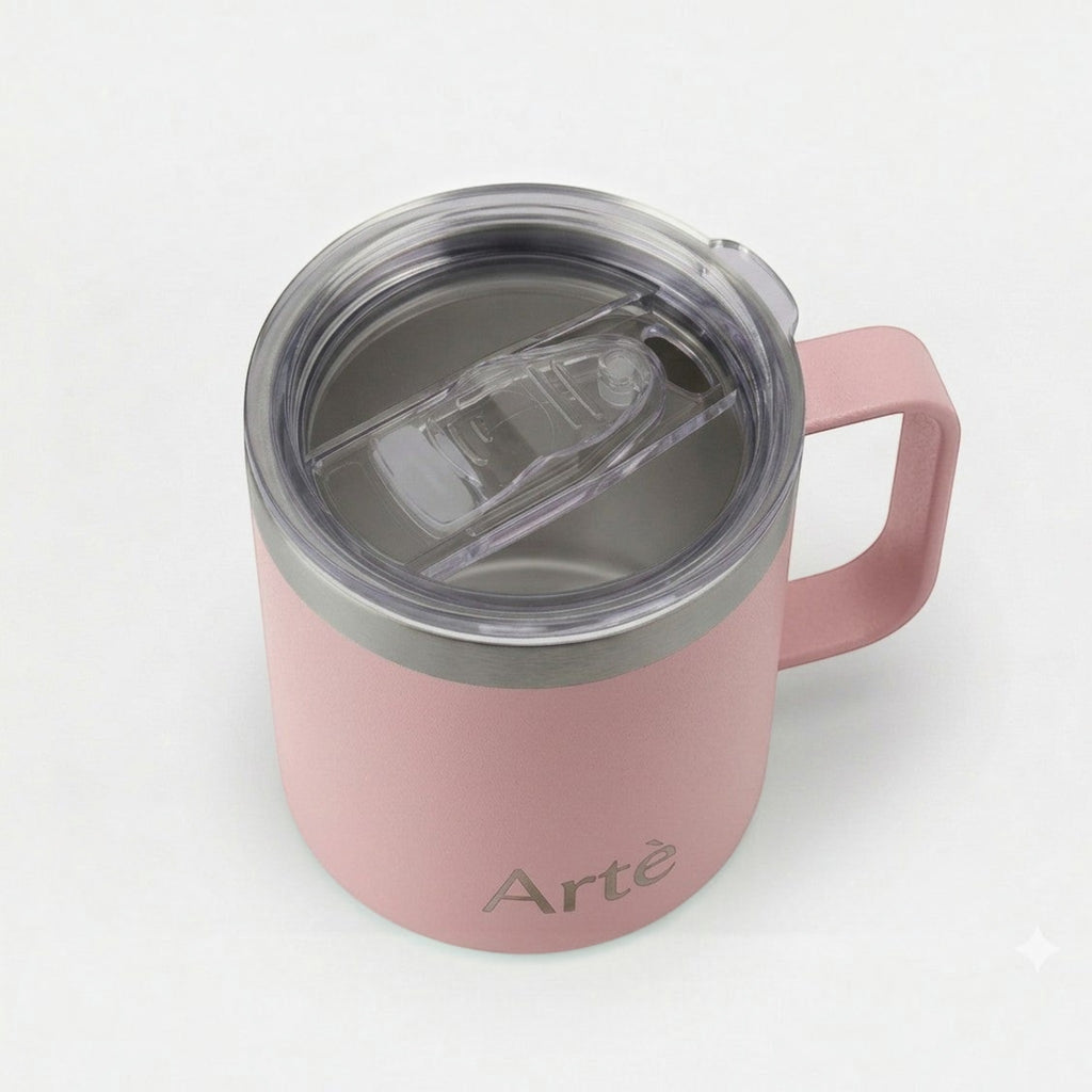 ArtèCup pink insulated stainless steel mug with a clear leak-proof lid and ergonomic handle, top-down view.