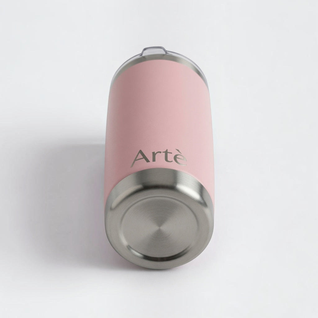 ArtèCup 20oz stainless steel tumbler in matte pink with a leak-resistant lid, viewed from the bottom angle.
