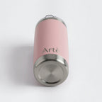 ArtèCup 20oz stainless steel tumbler in matte pink with a leak-resistant lid, viewed from the bottom angle.