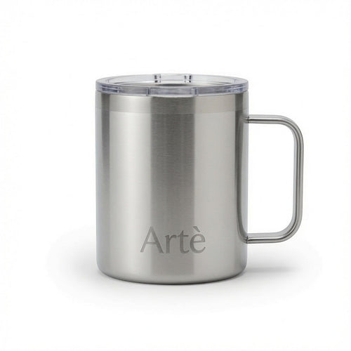 ArtèCup 12oz stainless steel insulated mug with ergonomic handle and clear leak-proof lid in a brushed silver finish.