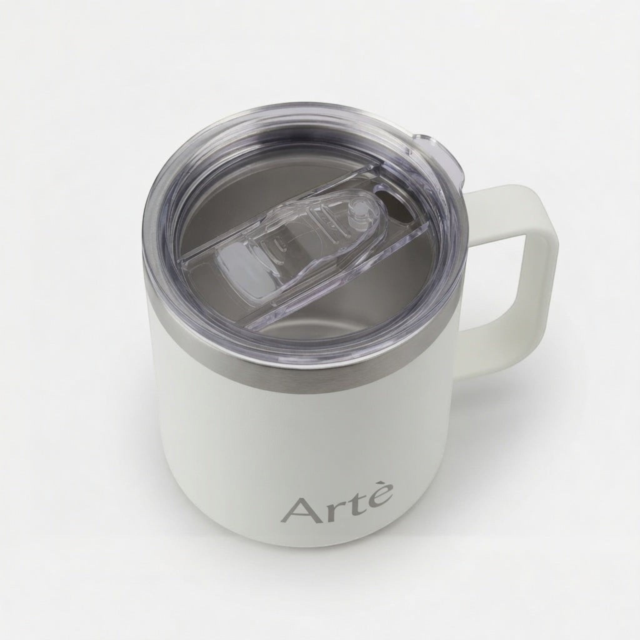 ArtèCup white stainless steel insulated mug with a clear leak-proof lid and ergonomic handle, top-down view.